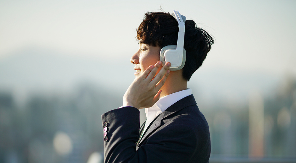 Man with headphones outside